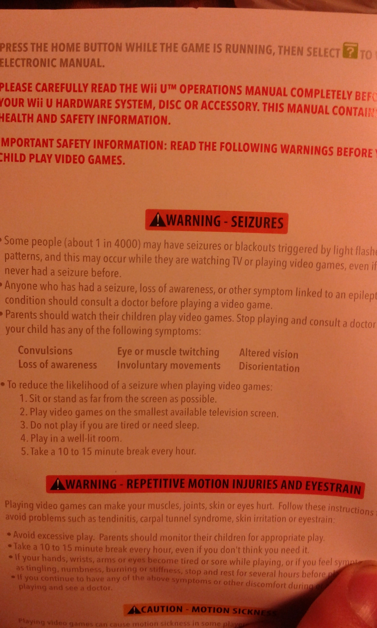 Photo of seizure warning in the Super Smash Bros WII U instruction manual. Similar warnings have been issued by Nintendo and other video game companies for decades due to flashing lights in games. 