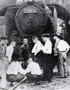 Investigators inspecting the train that killed Shimoyama.