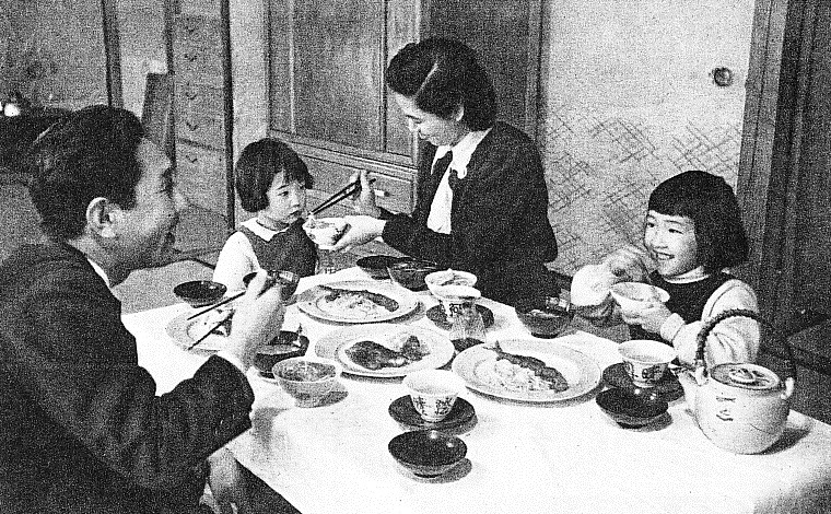 Japanese Family sharing a meal in the 1950's. 