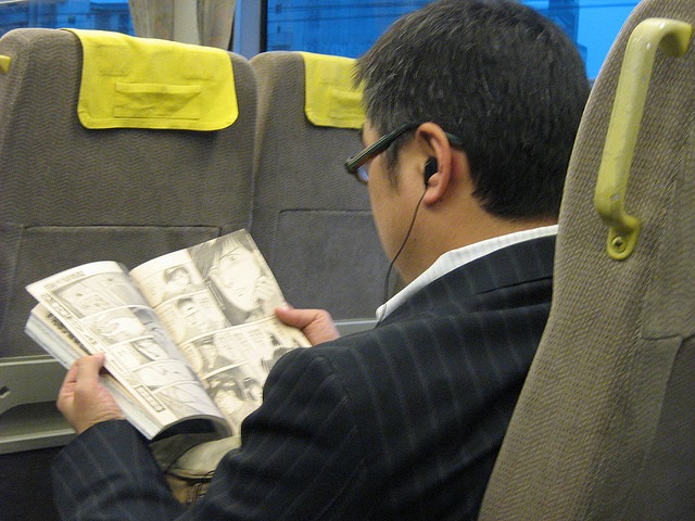 reading manga on a train